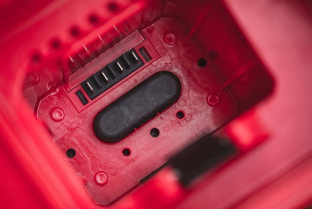 Red and Black Cramer 82V Professional 6 Slot Rapid Charging Station charging port