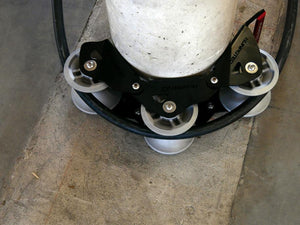 The Runpotec cable guide roller - 3 part - can be used for pulling cables gently around corners with the least possible resistance - example picture showing SWA cable running around a concrete post