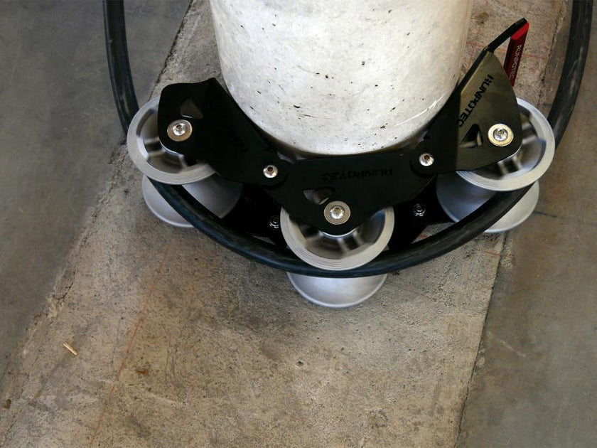 The Runpotec cable guide roller - 3 part - can be used for pulling cables gently around corners with the least possible resistance - example picture showing SWA cable running around a concrete post