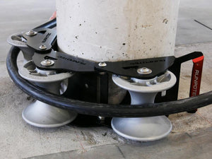 The Runpotec cable guide roller can be used for pulling cables gently around corners with the least possible resistance - example picture showing SWA cable running around a concrete post